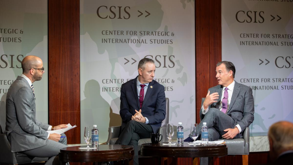 Reps. Tom Suozzi and Brian Fitzpatrick on stage