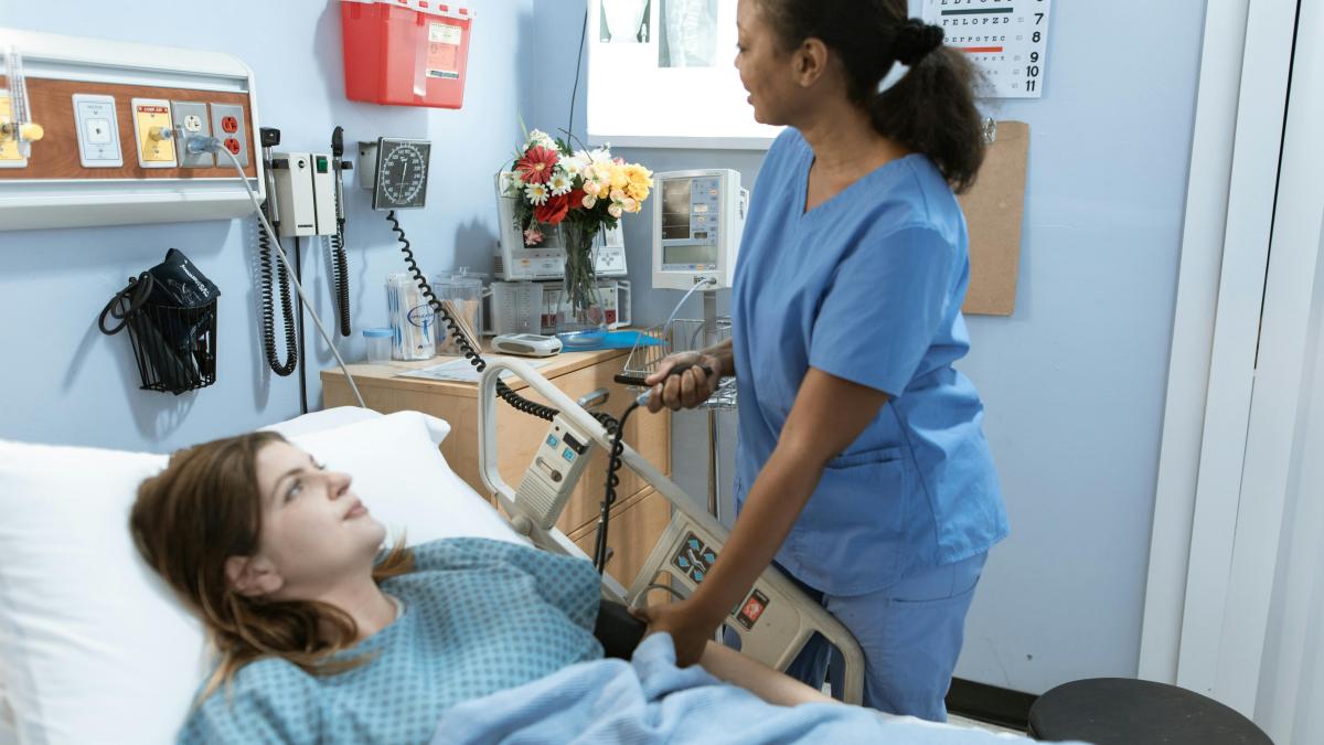 Nurse taking patient's blood pressure