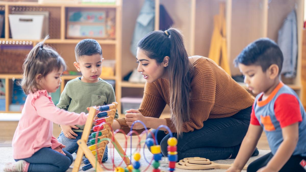 Child care professional with children