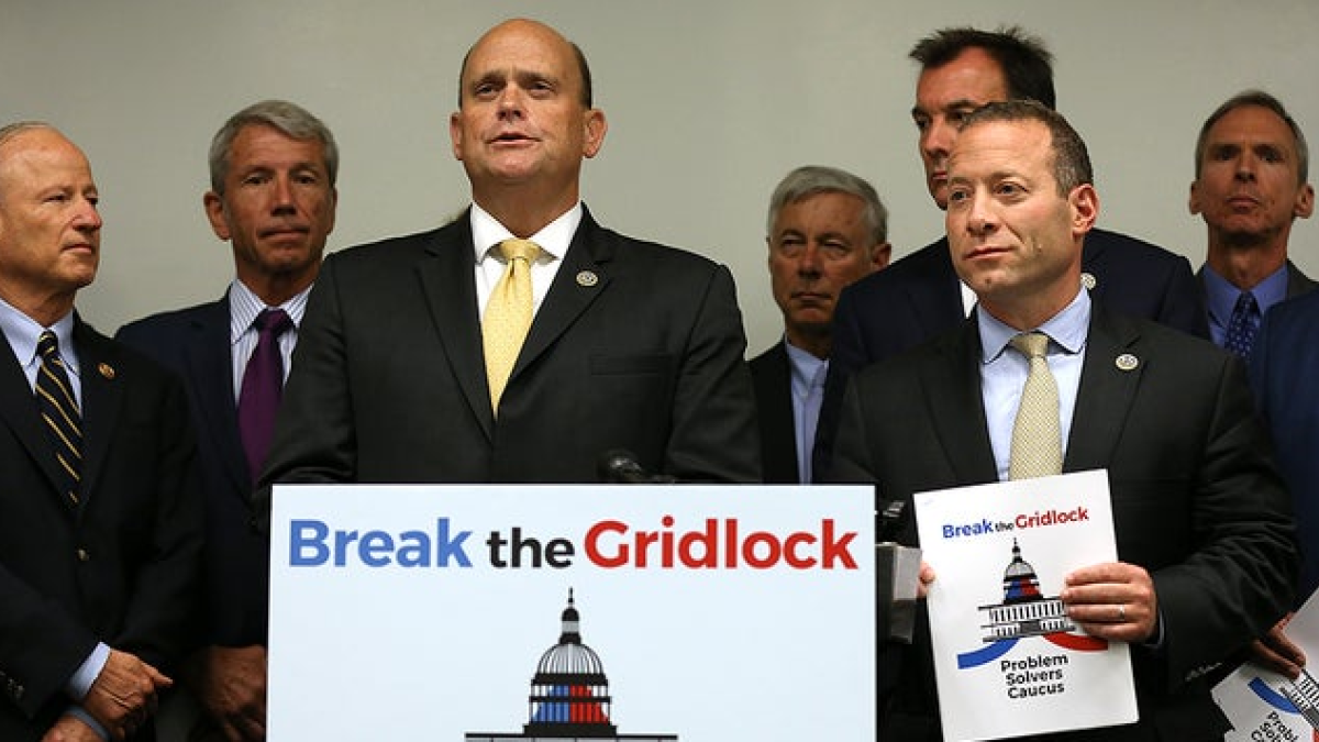 Problem Solvers members holding a break the gridlock sign